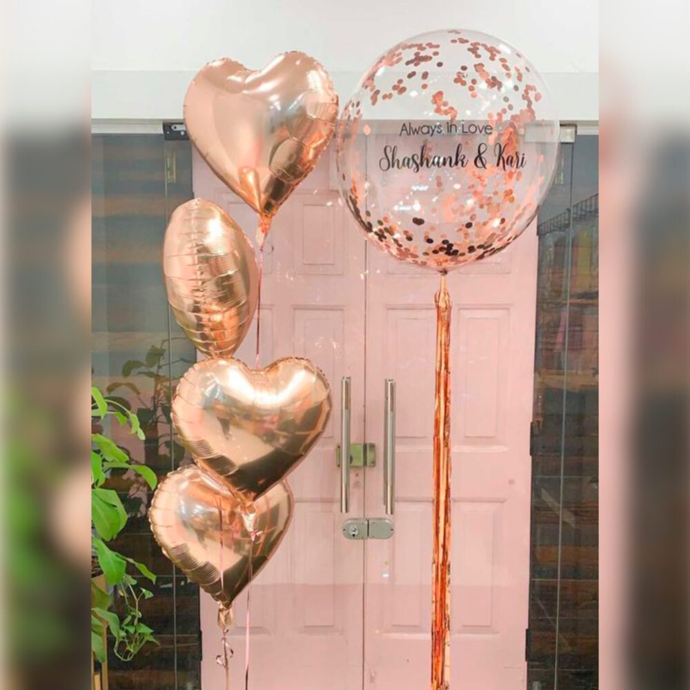 1 Globo burbuja con mensaje personalizado HELIO + 4 globos corazones metálicos HELIO